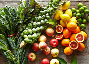 a group of fruits and vegetables on a wood surface Healthy Weight Loss Diets Henley In Arden